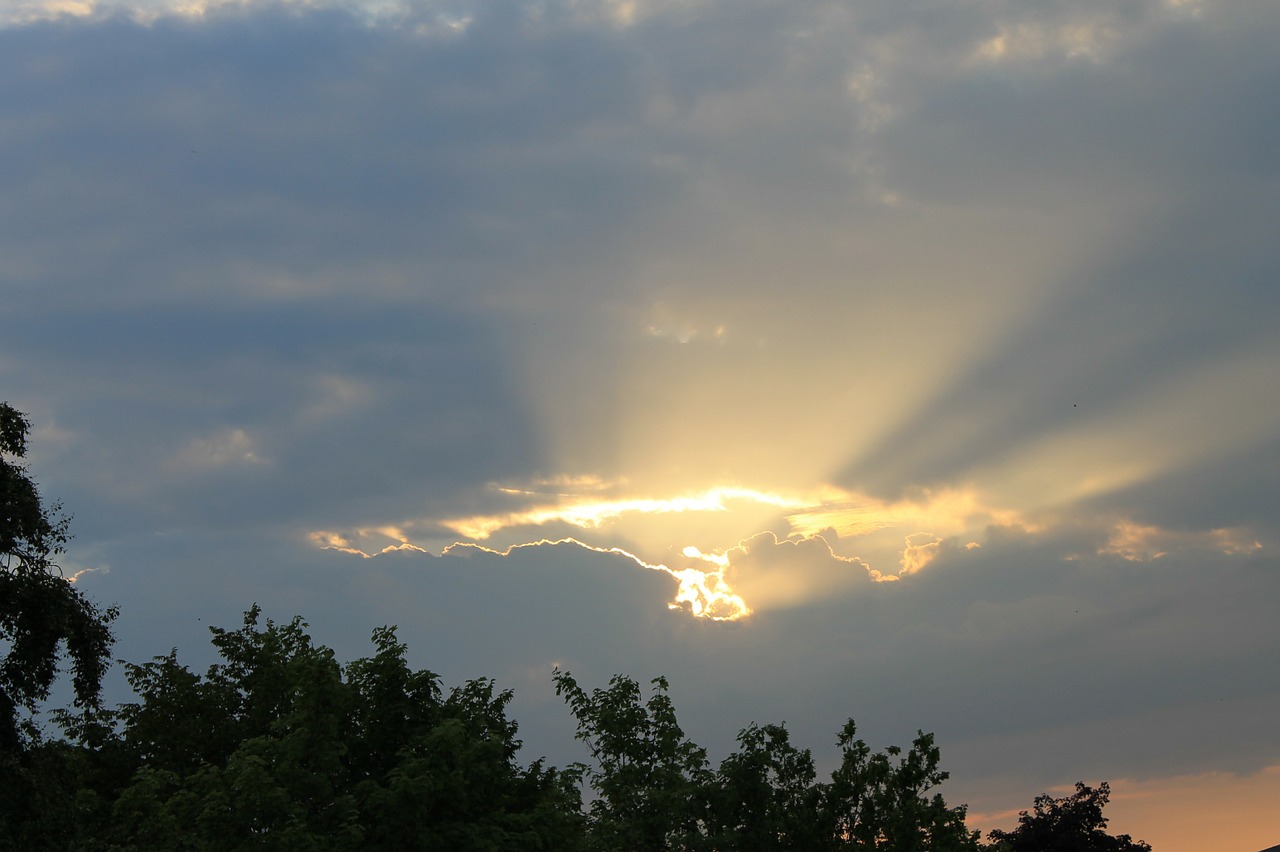 sunrays sunbeams clouds free photo