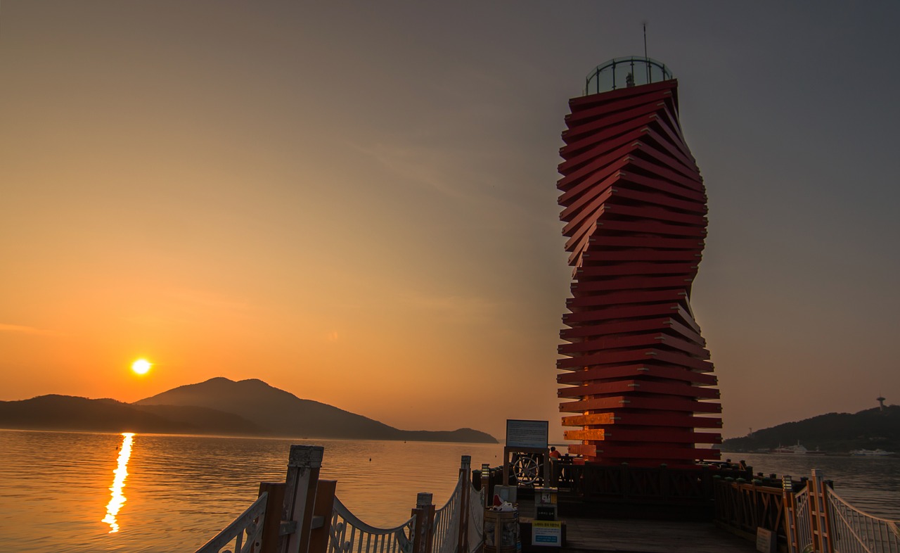 sunrise lighthouse sea free photo