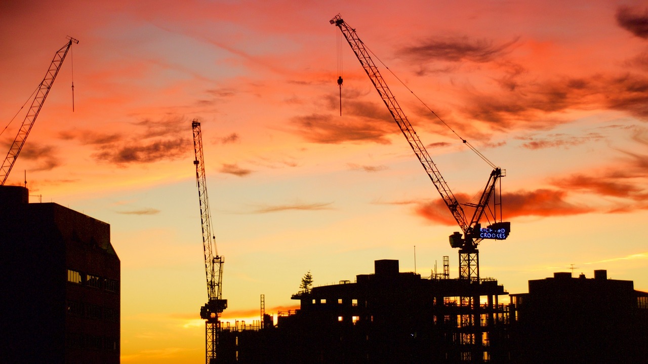 sunrise construction cranes free photo