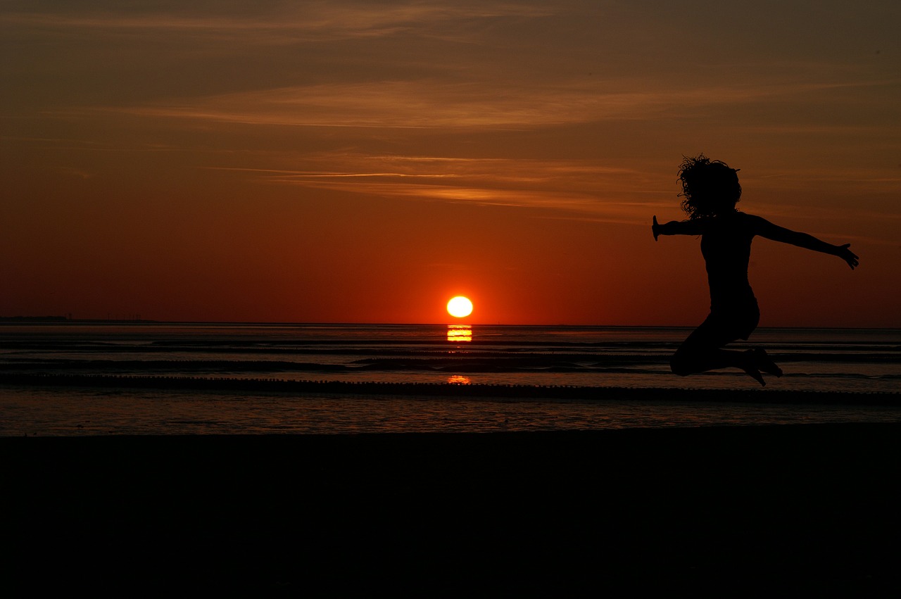 sunrise women's beach free photo