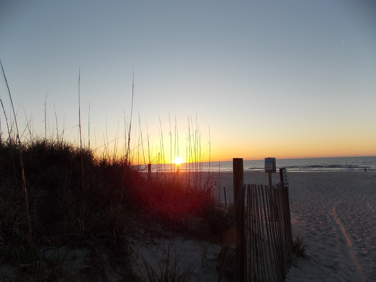 sunrise beach fence free photo