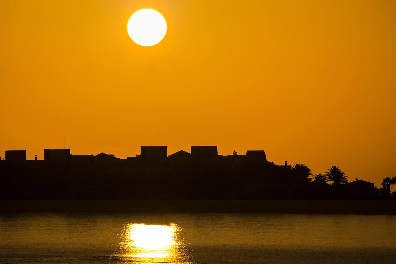 sunrise sun houses silhouette free photo