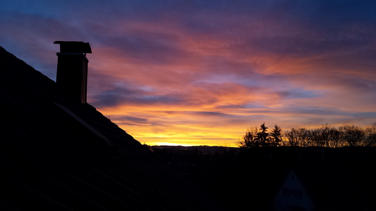 sunrise against the clock in the summer free photo