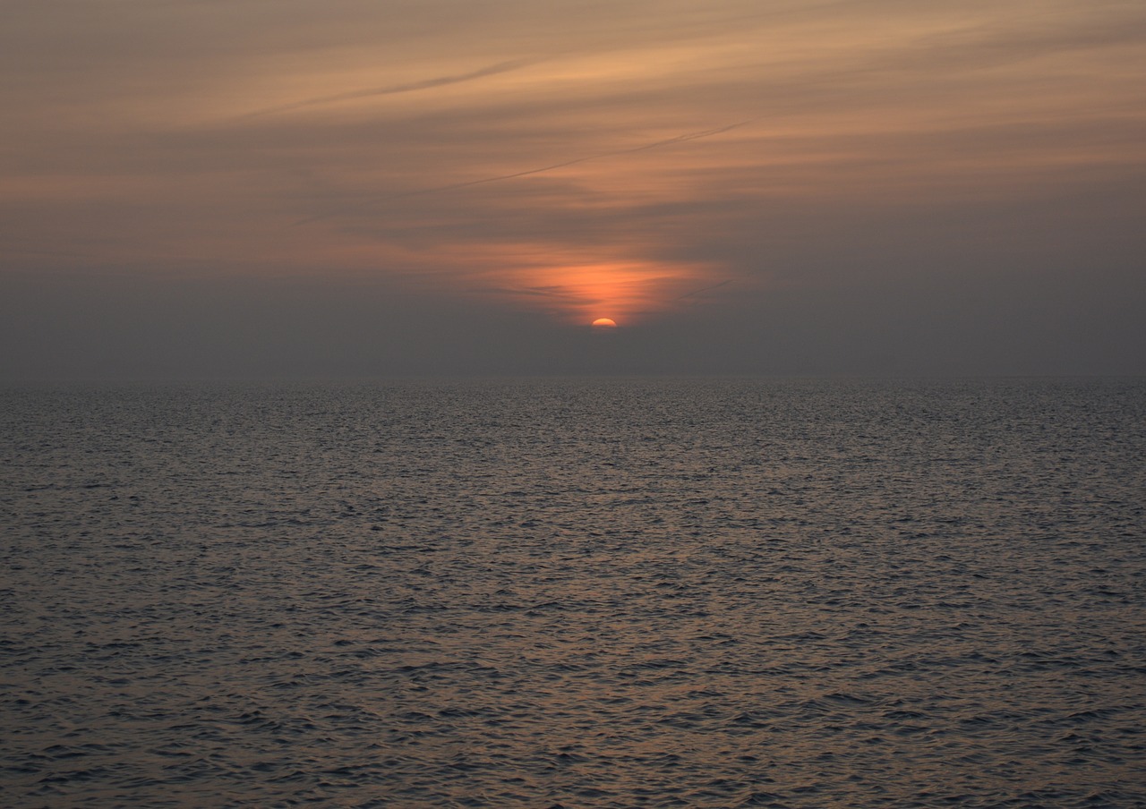 sunset evening sky north sea free photo