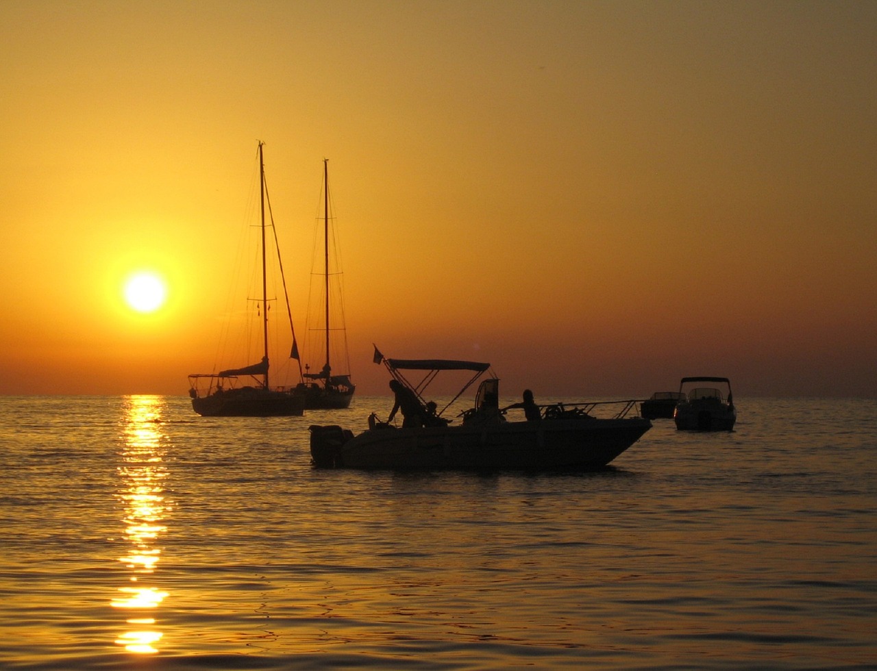 sunset ocean boats free photo