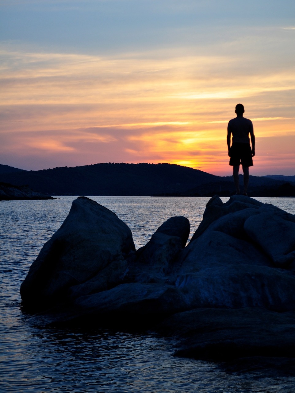 sunset ocean boulders free photo