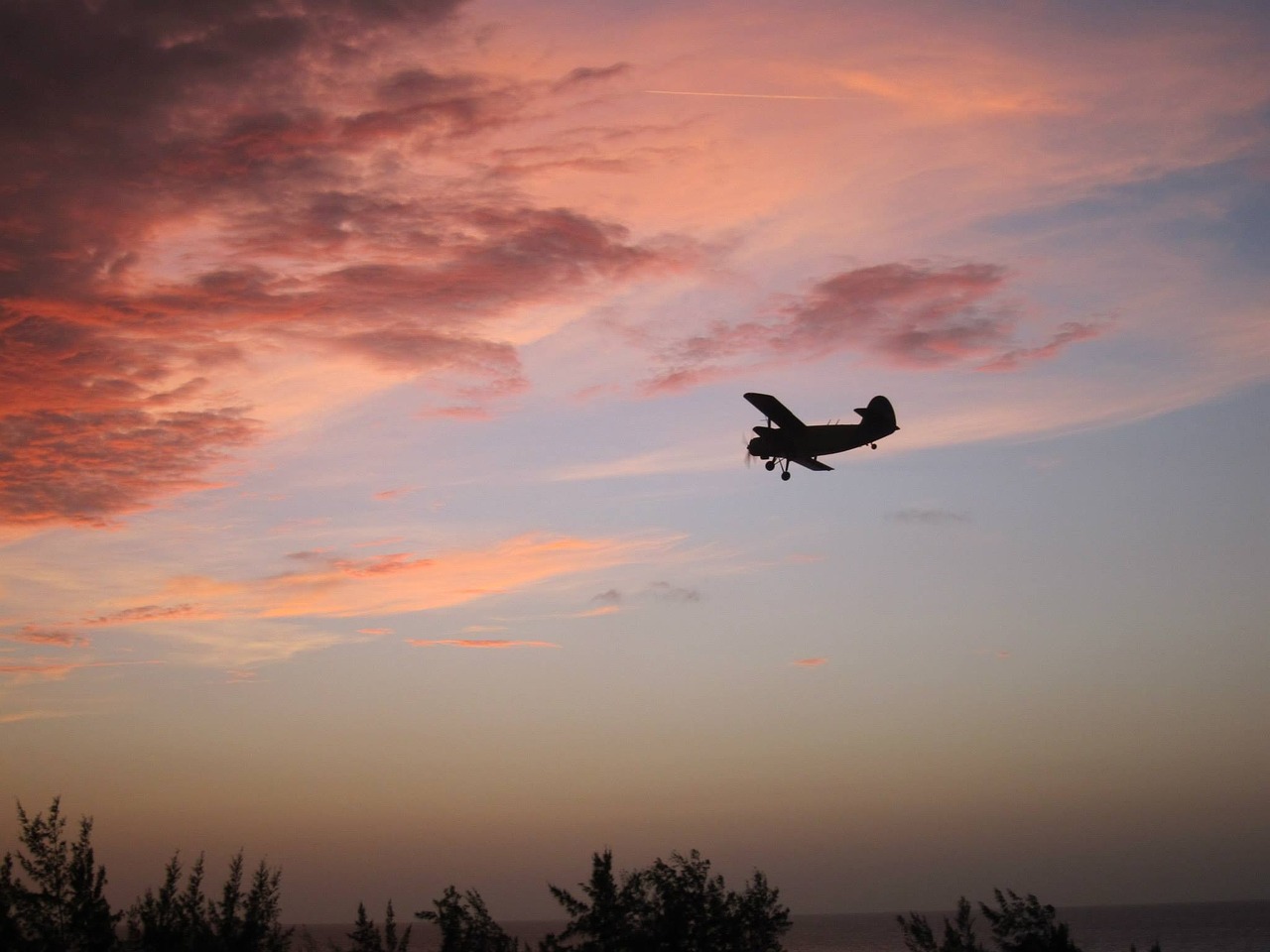sunset cuba biplane free photo