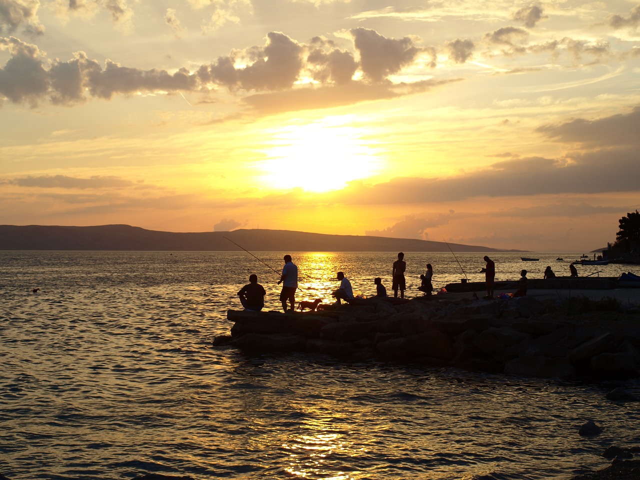 sunset fishing water free photo