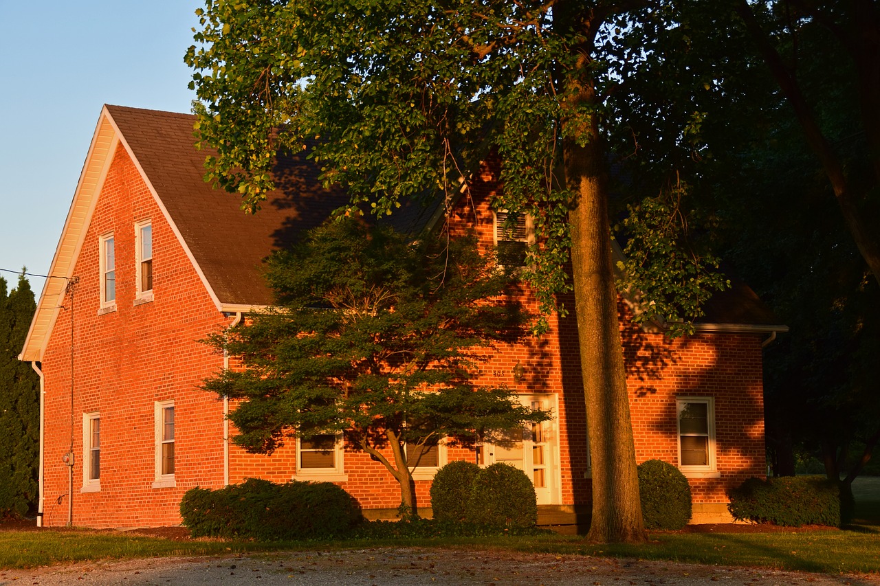 sunset farmhouse brick home free photo