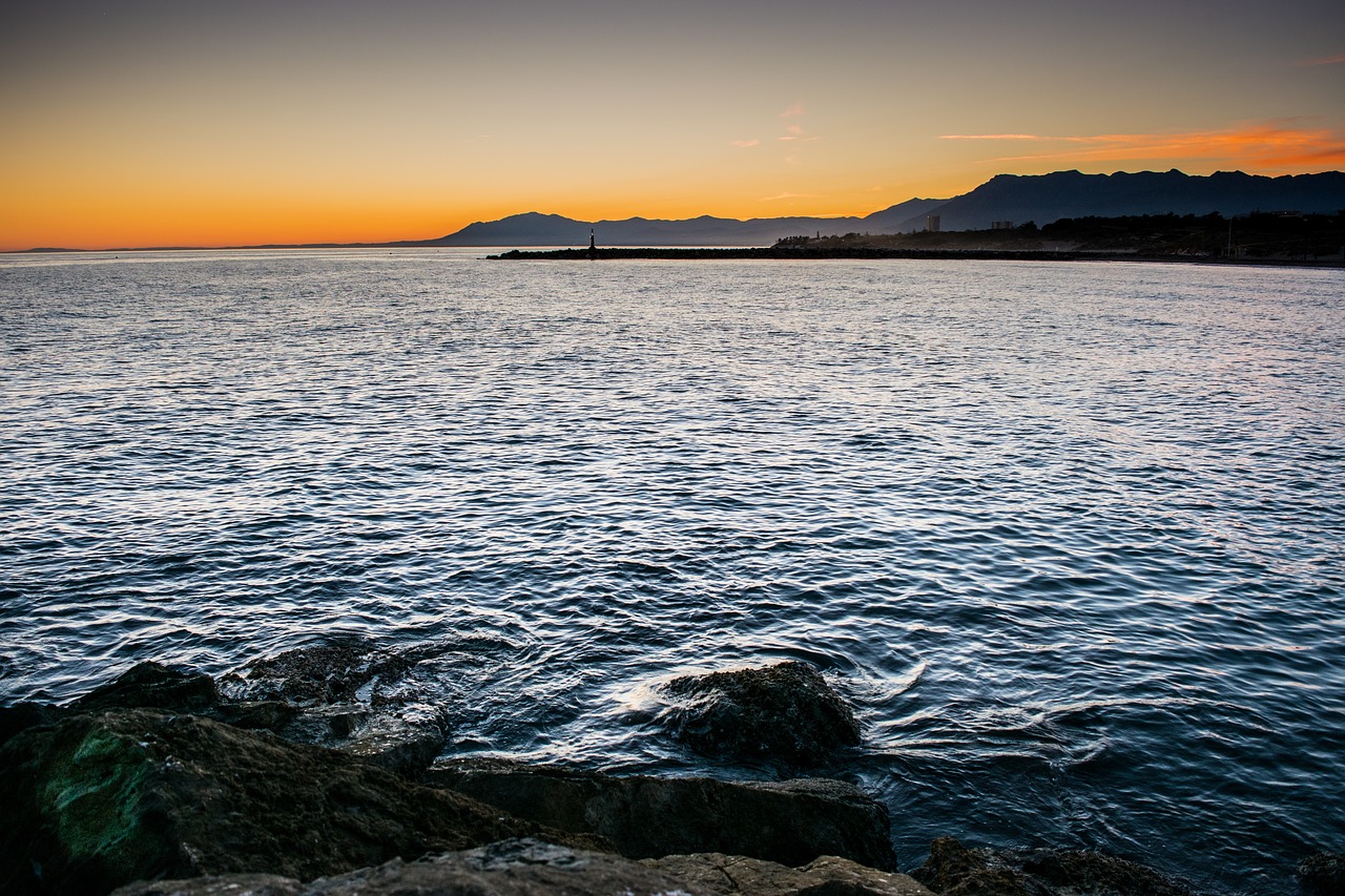 sunset sea lighthouse free photo