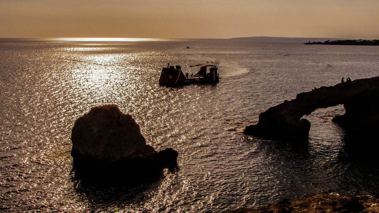 sunset rocky coast sea free photo