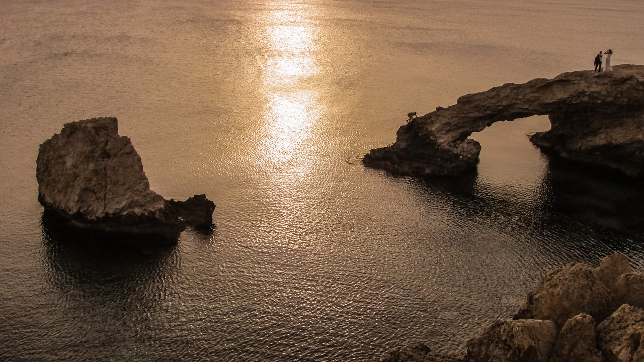 sunset rocky coast sea free photo