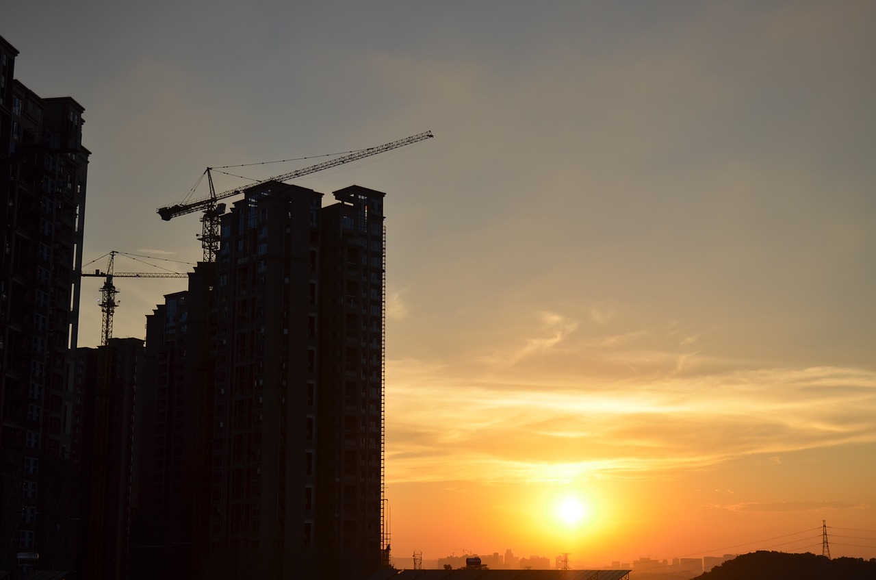 sunset building in the construction of city free photo