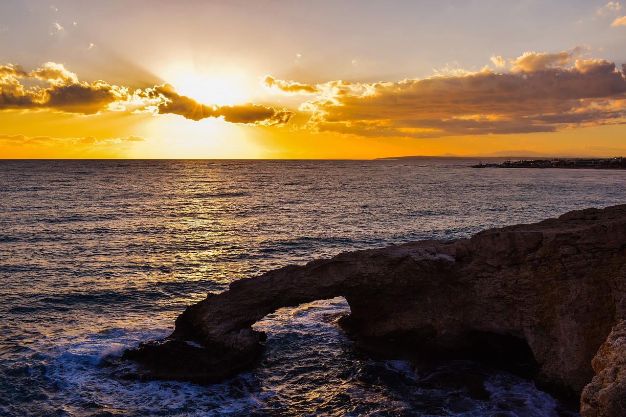 sunset rocky coast sea free photo