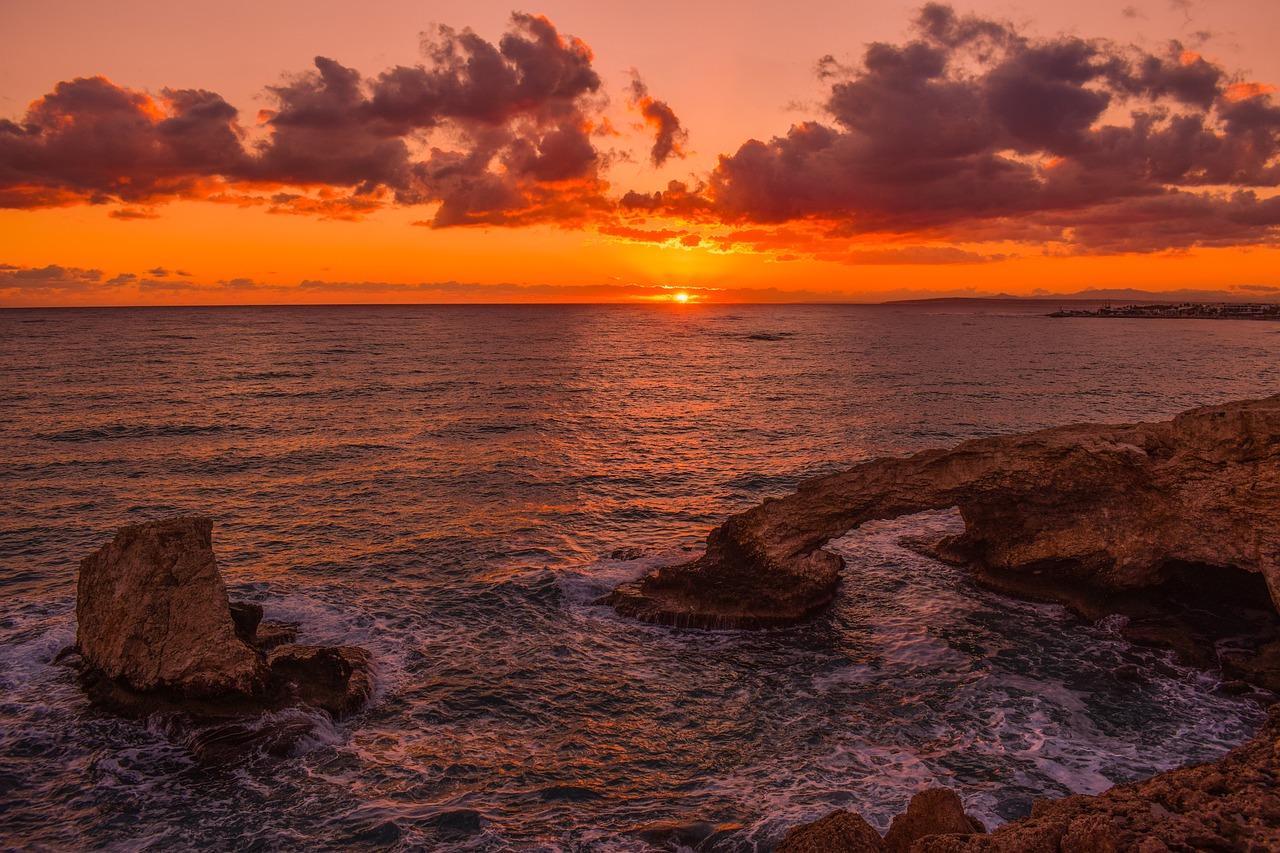 sunset rocky coast sea free photo