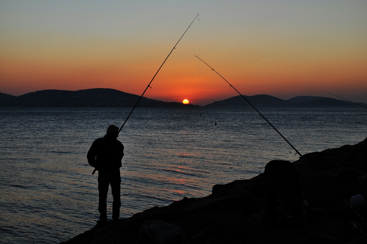 sunset fishing rod fisherman free photo