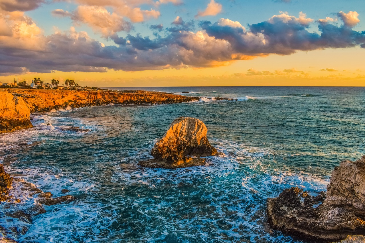 sunset rocky coast sea free photo