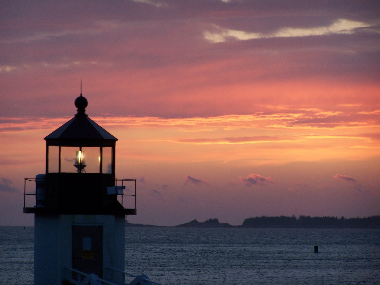 sunset water lighthouse free photo