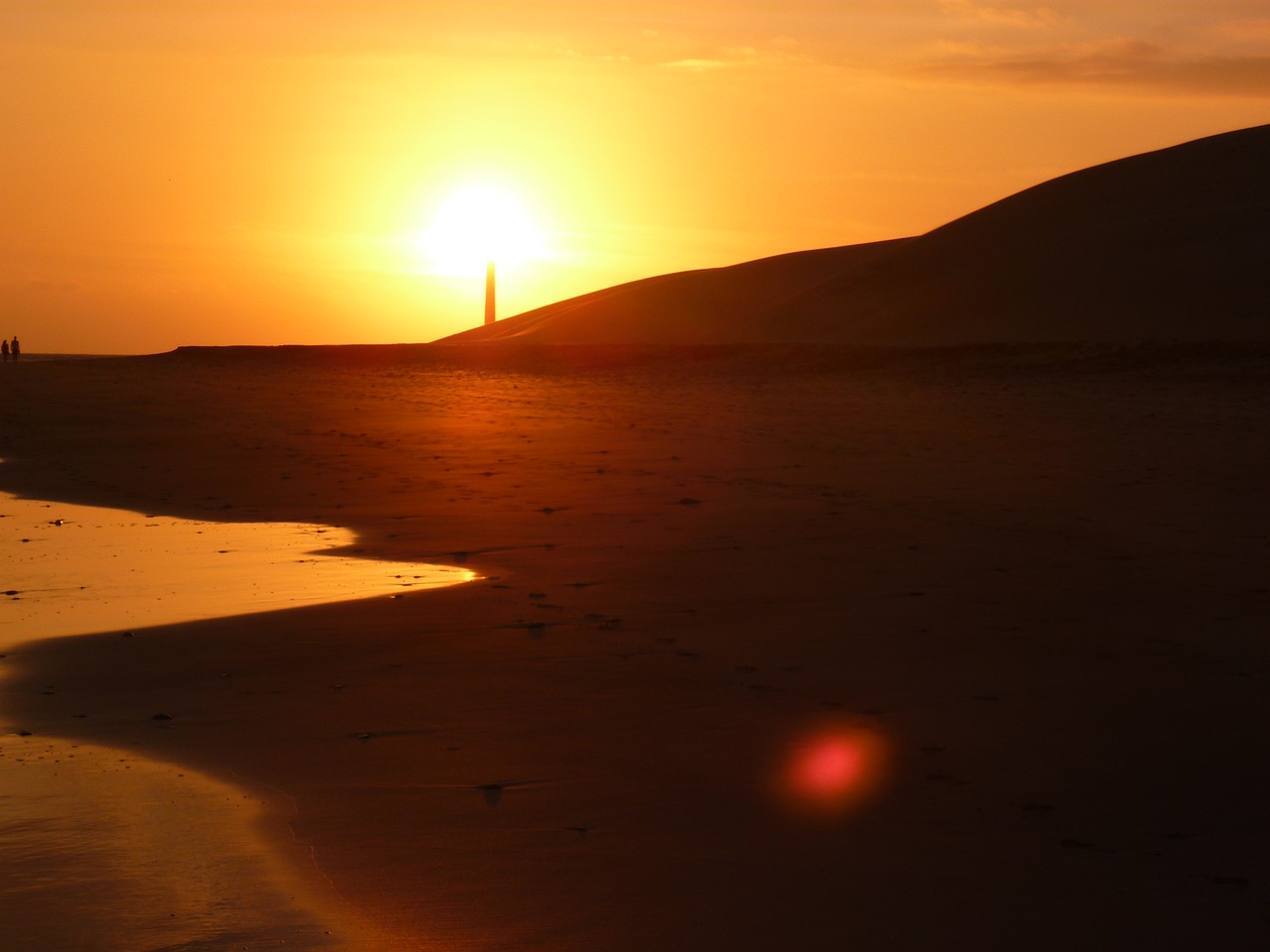 sunset beach lighthouse free photo