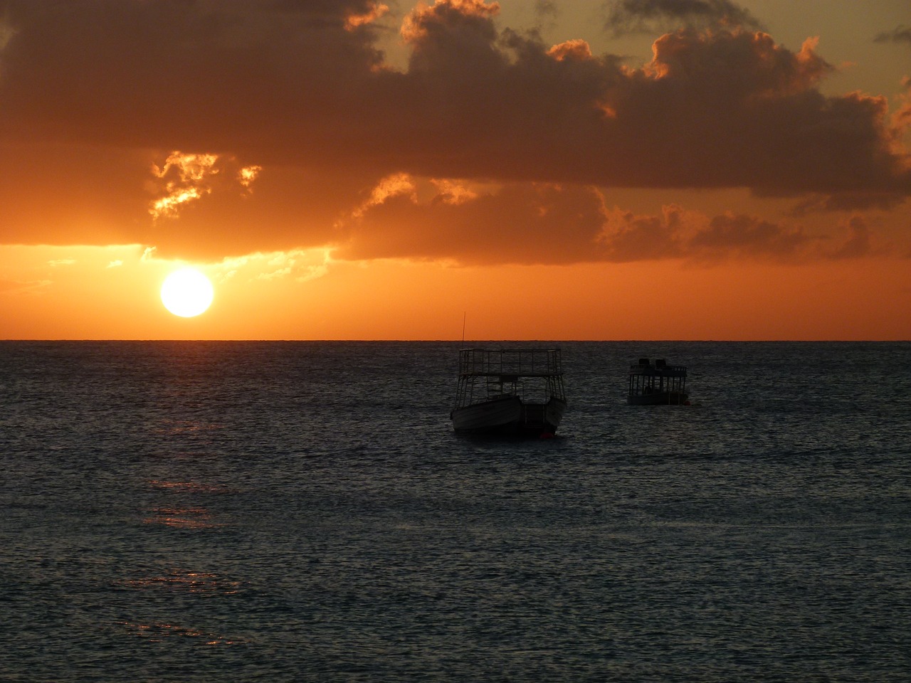 sunset orange clouds sunset at sea free photo