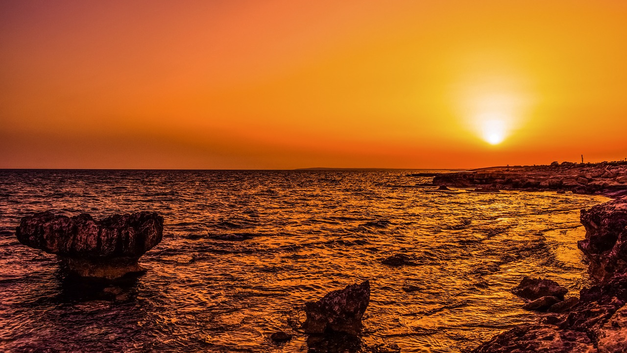 sunset sea rocky coast free photo