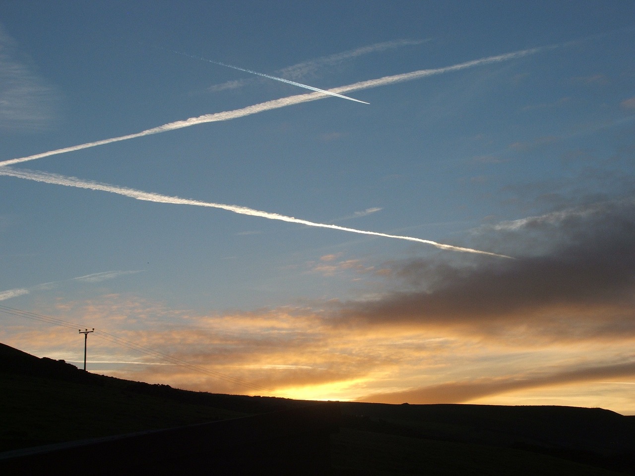 sunset contrails condensation trails free photo