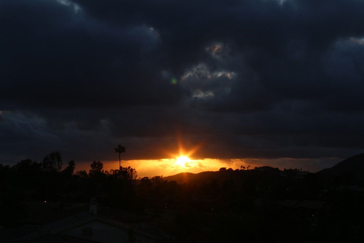 sunset bright sky dark clouds free photo