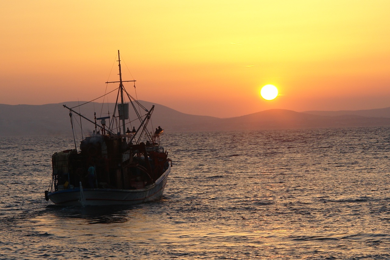 sunset boat sea free photo