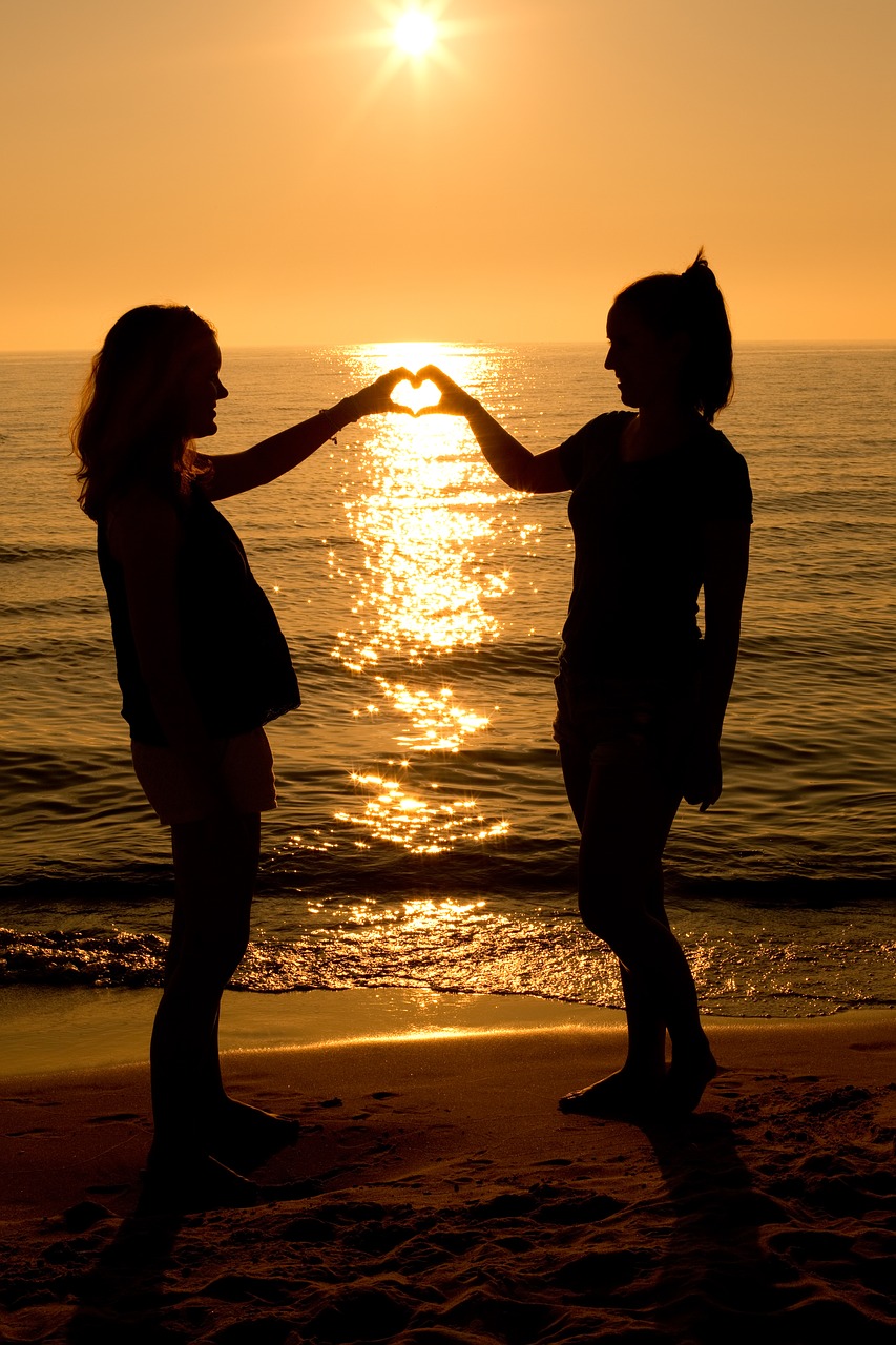 sunset heart two women free photo