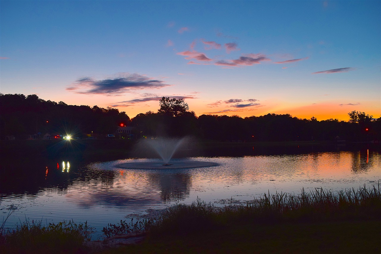 sunset pond fountain free photo