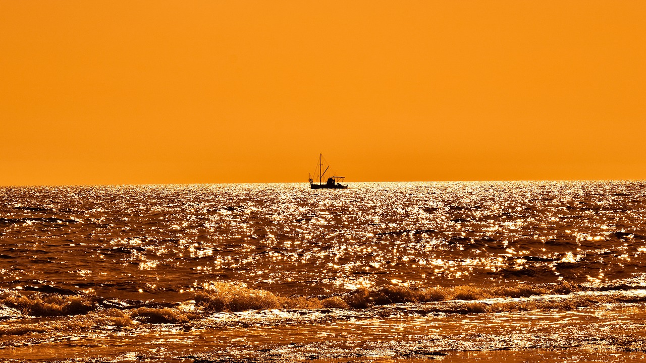 sunset fishing boat shadow free photo