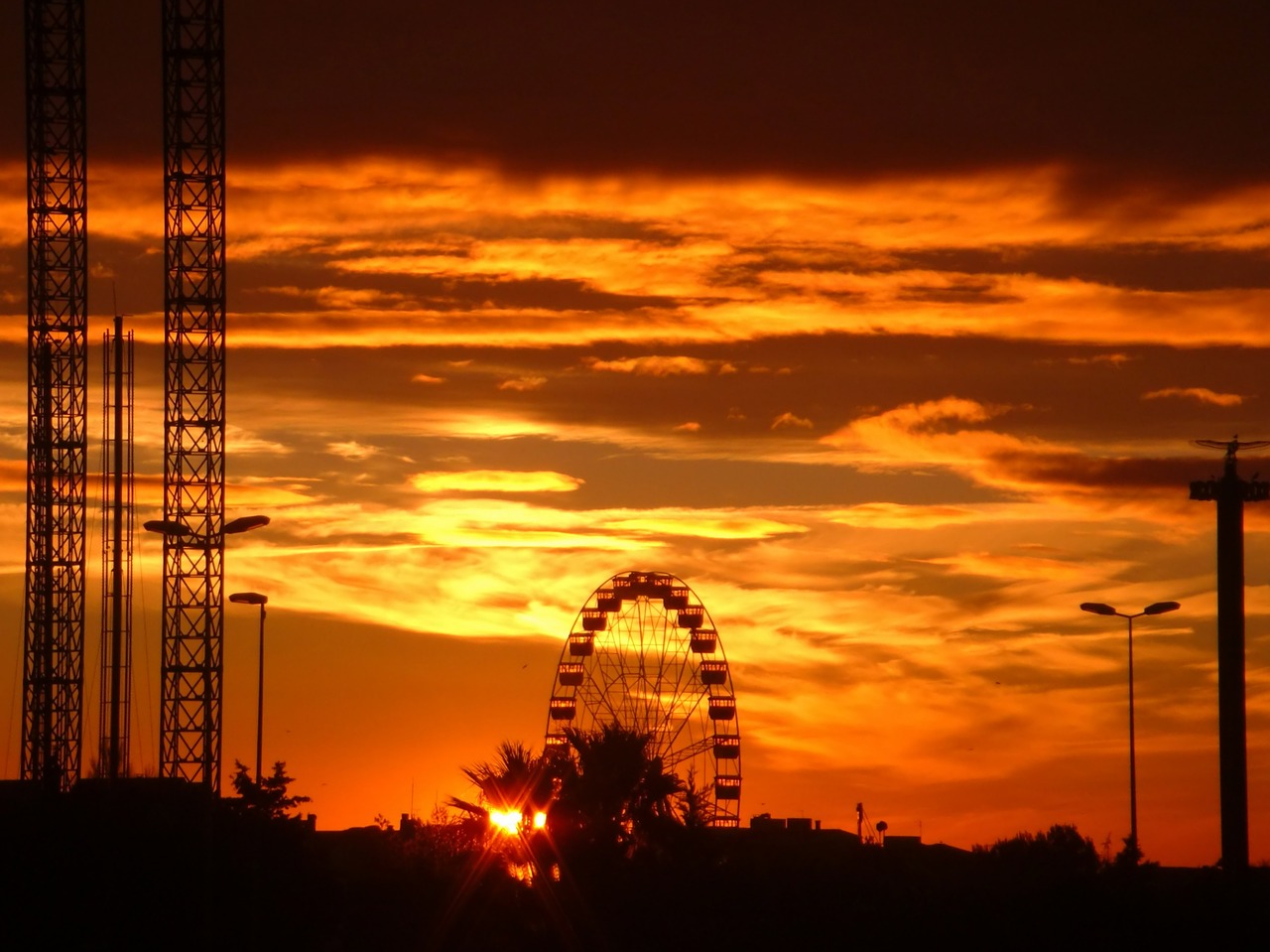 sunset ferris wheel sky free photo
