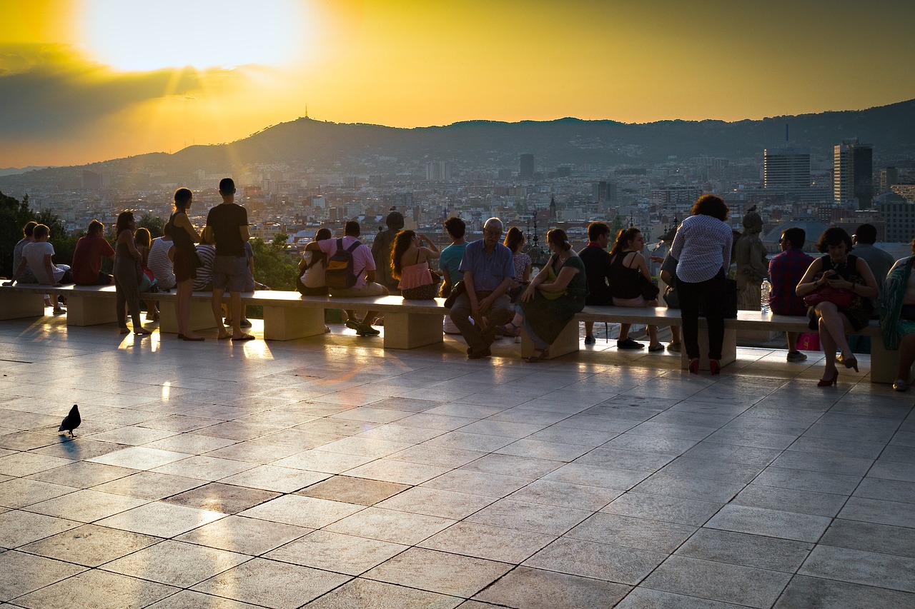sunset barcelona tourists free photo