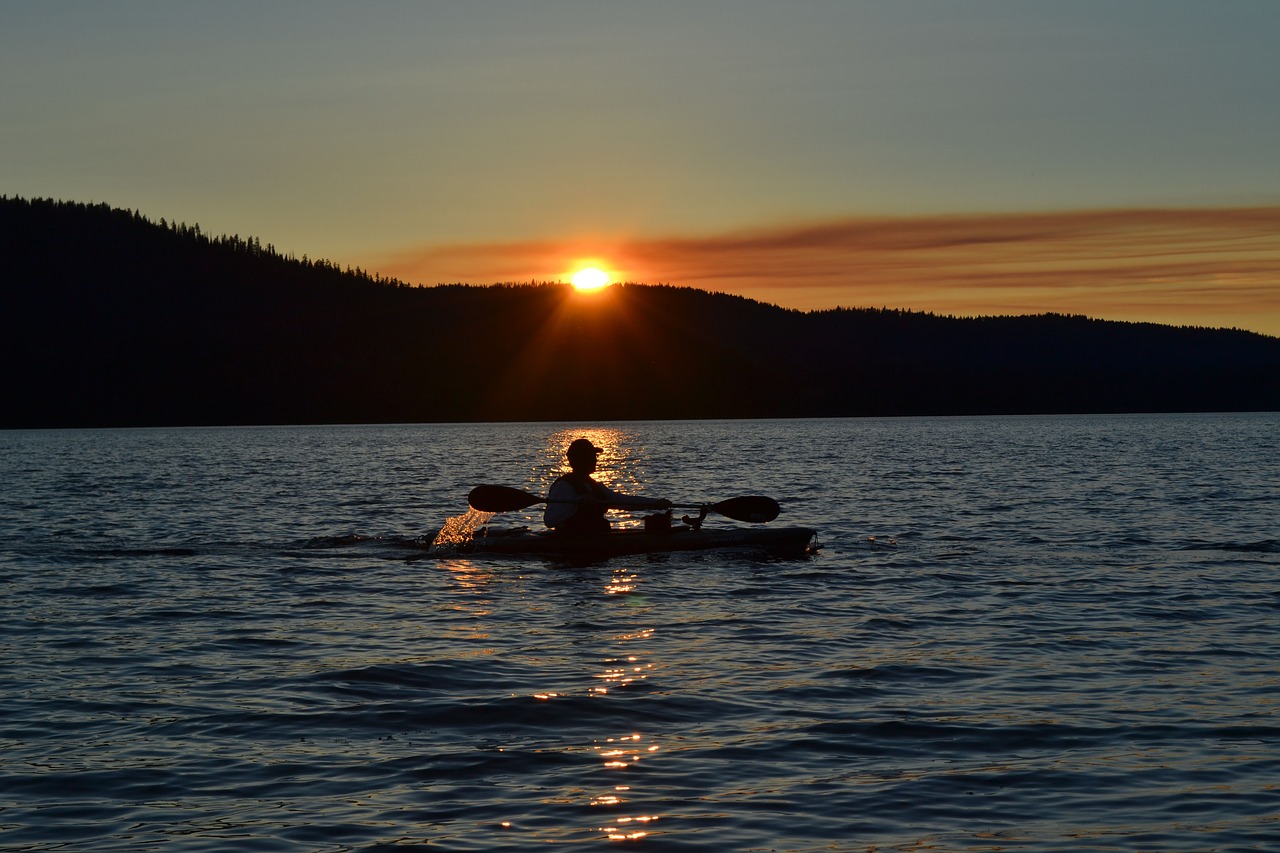 sunset mountains kayak free photo