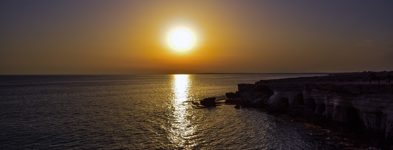 sunset sun sea caves free photo