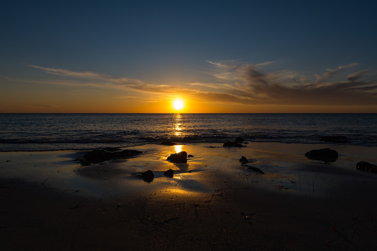 sunset beach rocks free photo