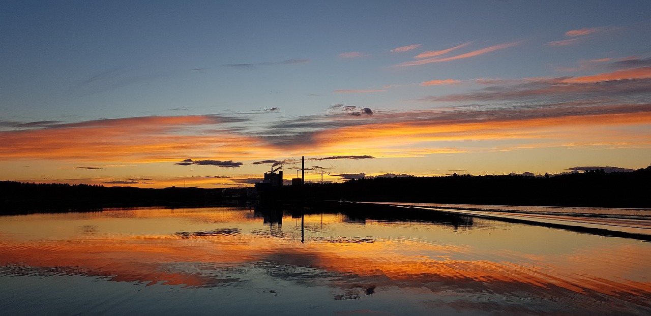 sunset dawn body of water free photo