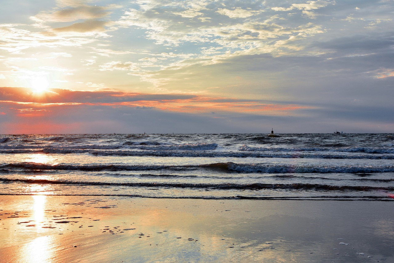 sunset body of water dawn free photo