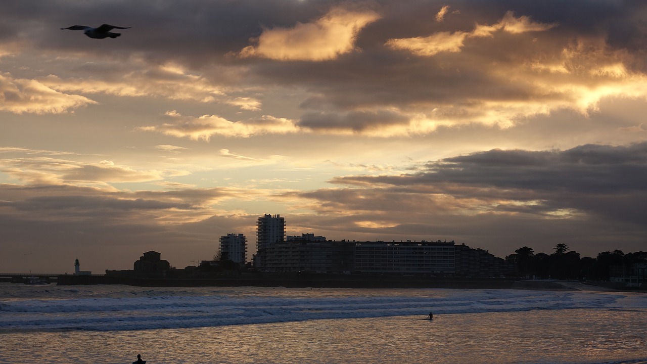 sunset body of water dawn free photo