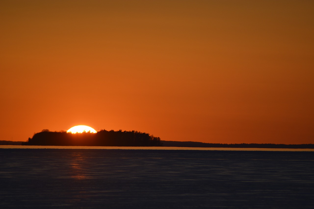 sunset dawn body of water free photo