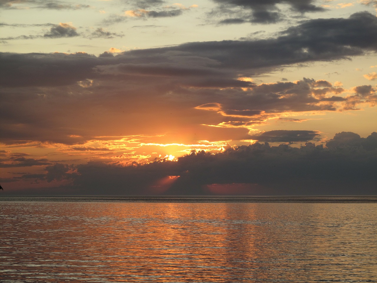 sunset water clouds free photo