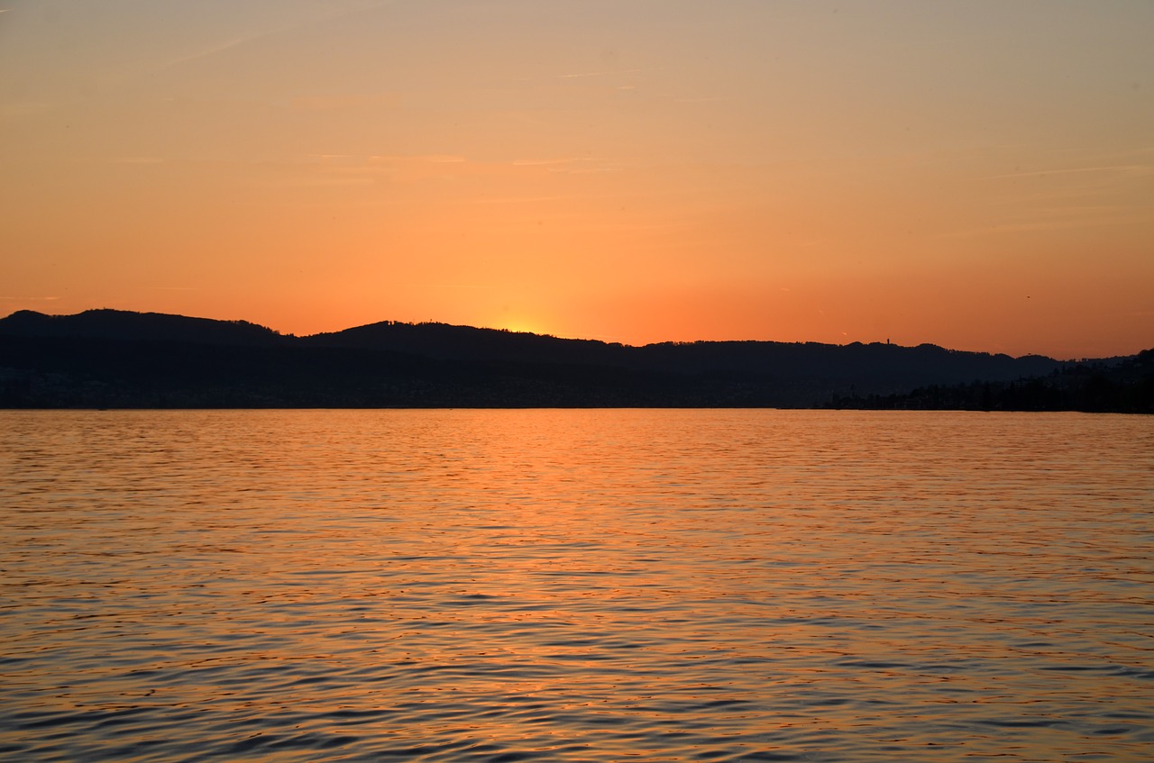 sunset  waters  lake zurich free photo