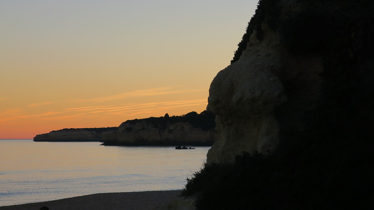 sunset  beach  cliffs free photo