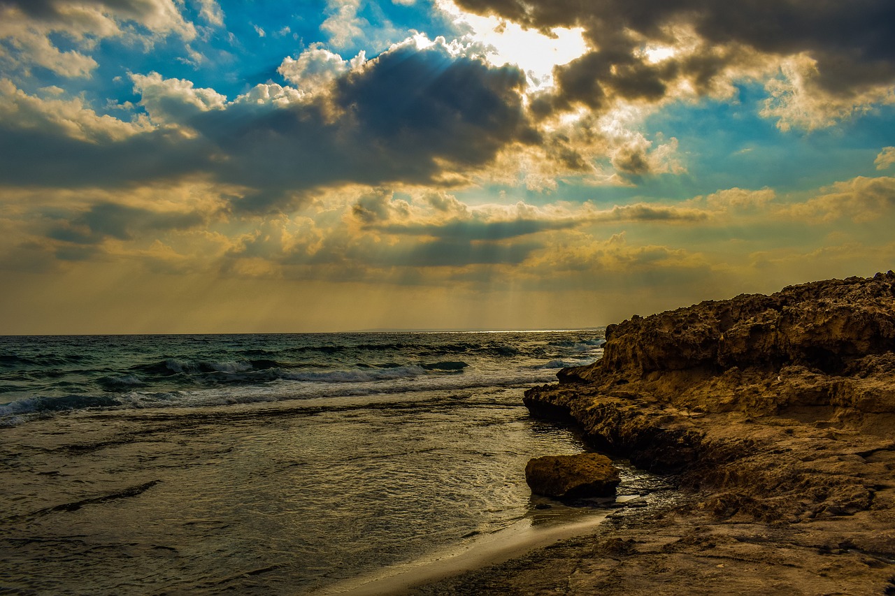 sunset  rocky coast  sea free photo