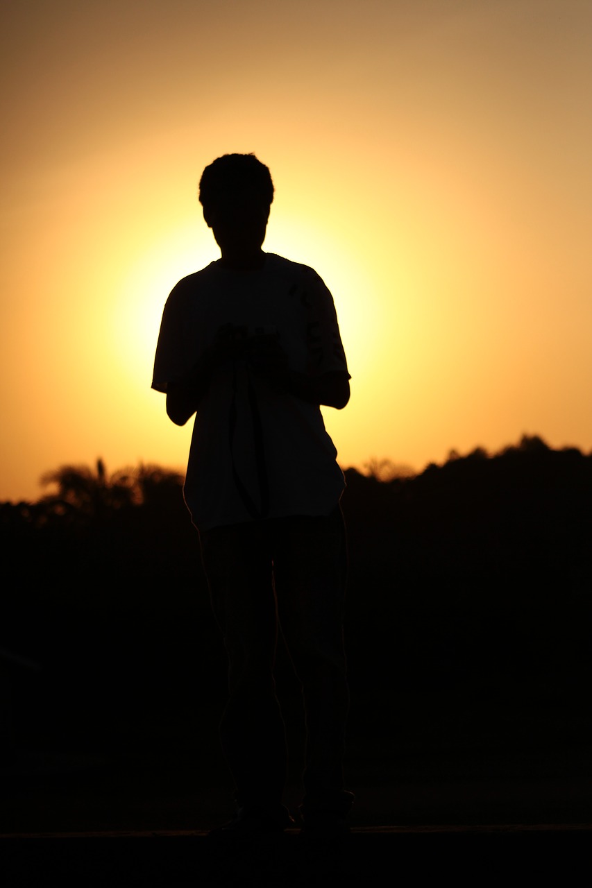 sunset  silhouette  man free photo