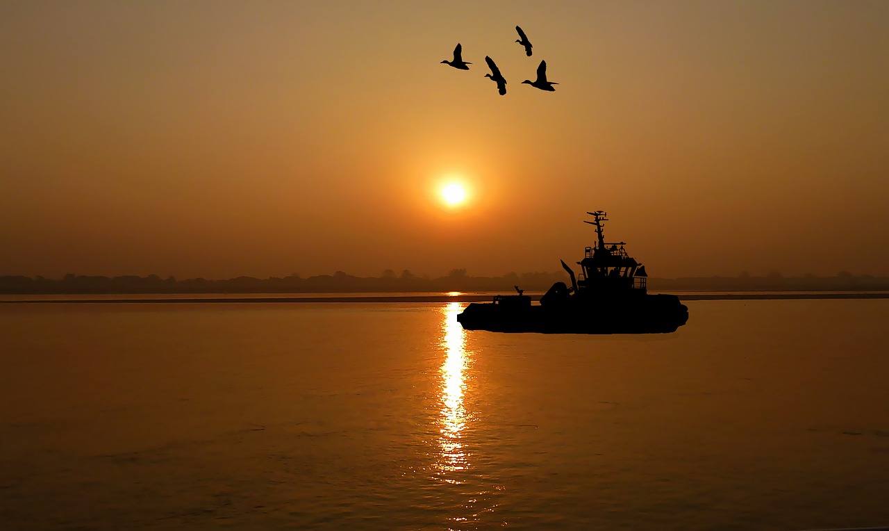 sunset  boat  tug free photo