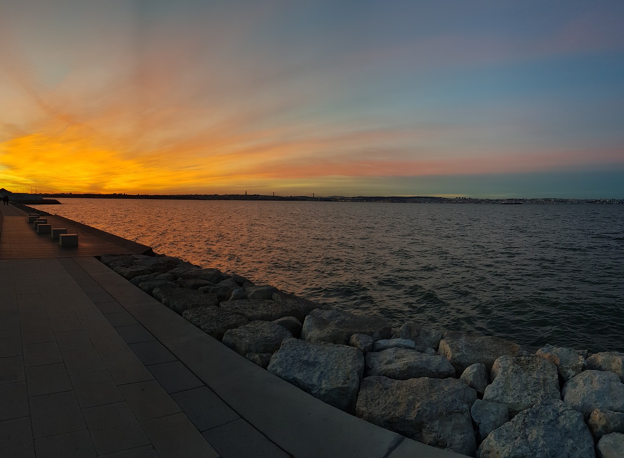 sunset  water  stones free photo