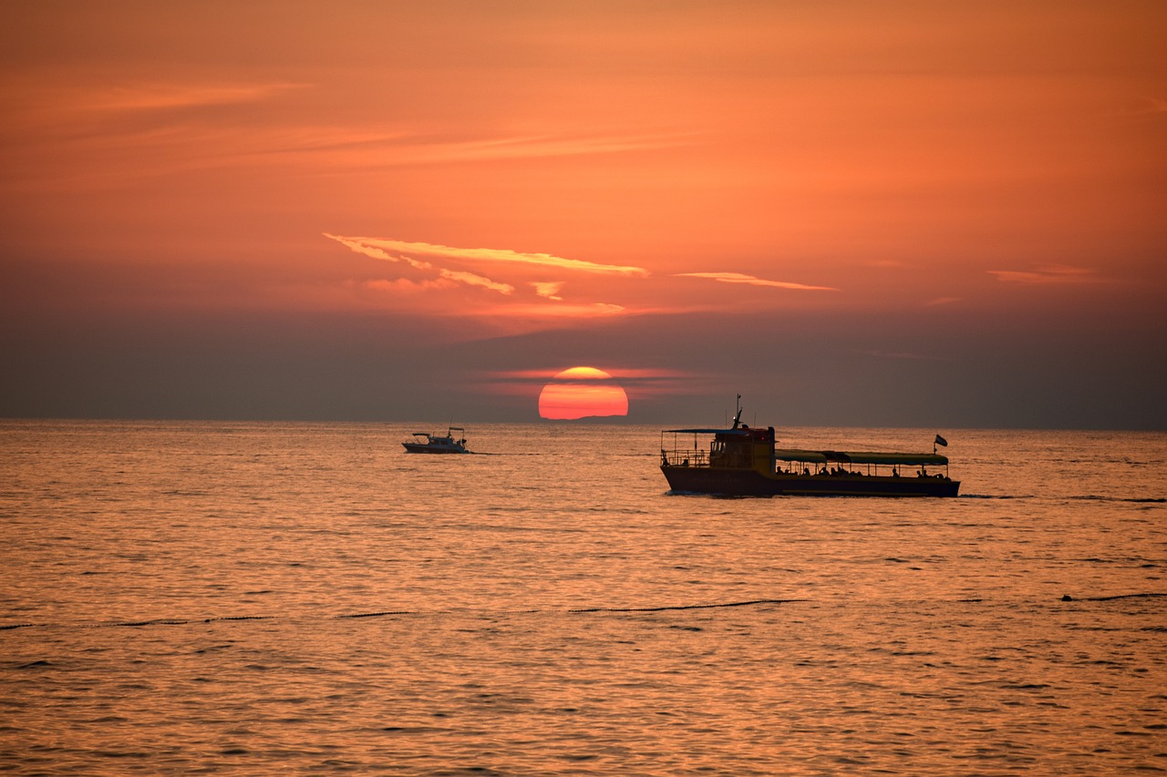 sunset  sea  boat free photo