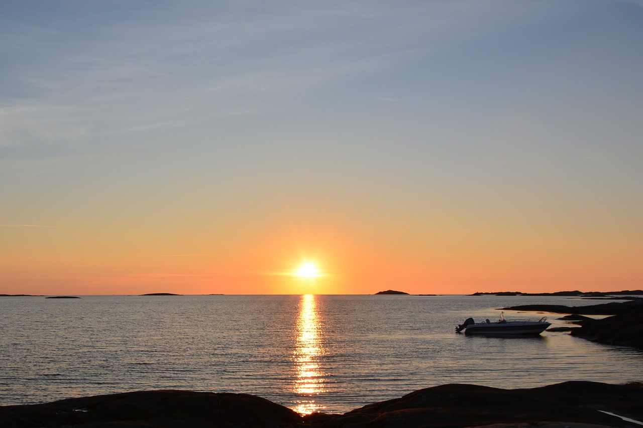 sunset  sea  boat free photo