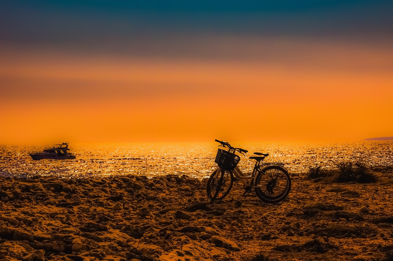 sunset  bikes  boat free photo